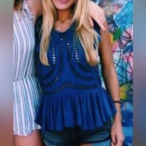 Free people blue cut out embroidered top